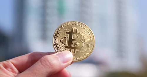 Hand Holding Bitcoin Cryptocurrency Close Up