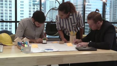 Creative Business People Group Having Conversation at Office Desk in Workplace