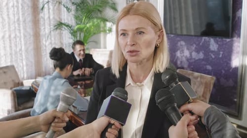 Woman Answers Questions at Press Conference