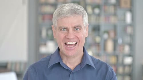 Excited Man Celebrating Success in a Close Up