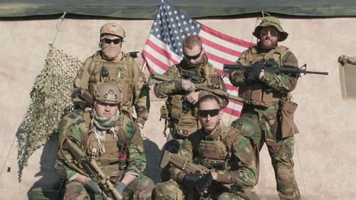 Soldiers Posing With American Flag and Rifles