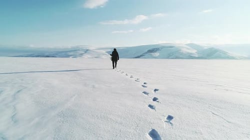 Walking on Frozen Lake and Footsteps