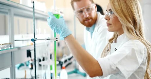 Young Students of Chemistry Working in Laboratory