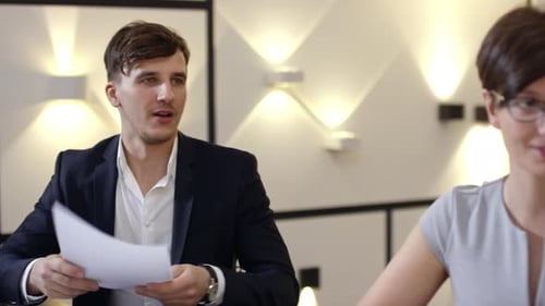 Young Manager at Meeting with Partners
