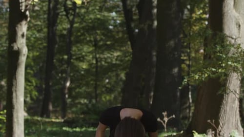 Woman Flips Hair in Green Park Setting