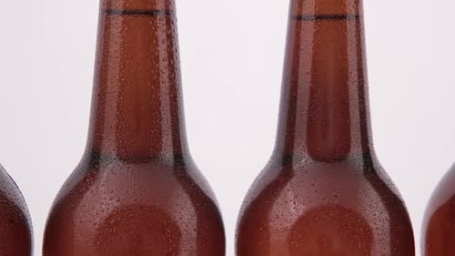 Chilled Beer Bottles with Condensation Close Up