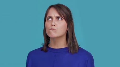 Portrait of Concentrated Brunette Female 30s Biting Lips Thinking About Things Doubting Suddenly