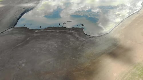 Lake in The Middle of The Treeless Meadow with Aerial View