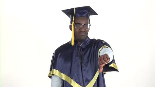 Graduate Showing Thumbs Down. White. Slow Motion. Close Up