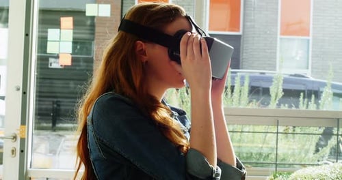 Woman Uses Virtual Reality Headset Indoors