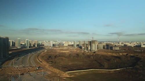 Aerial View of City Under Construction on Sunny Day