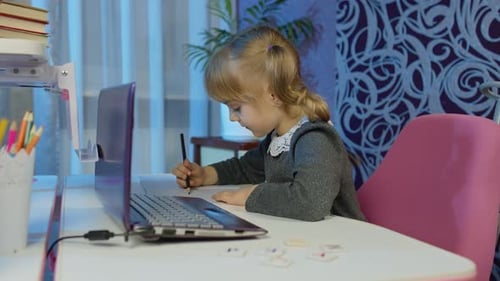 Child Girl Doing School Homework Using Laptop at Home Online Children Pupil Distance Education