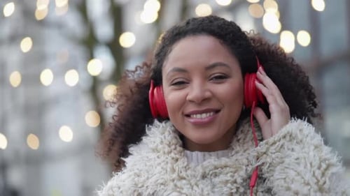 Woman Listening to Music Wearing Headphones