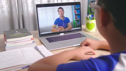 Child Learning Online with Laptop Computer at Home