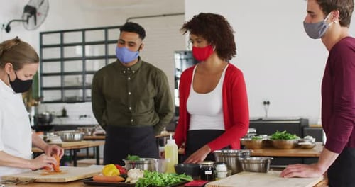 Adults Participating in a Cooking Class in Kitchen