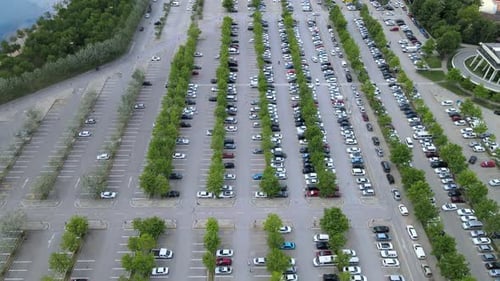 Cars Filling Large Parking Lot Aerial View