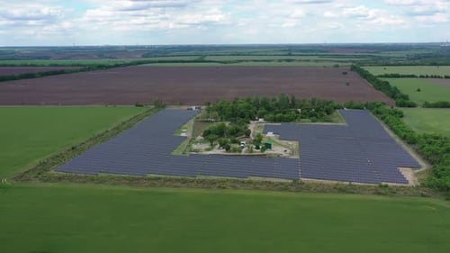 Aerial View on a Massive Solar Power Station in the Field, Renewable Energy