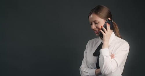Smiling Woman Talking on a Cell Phone