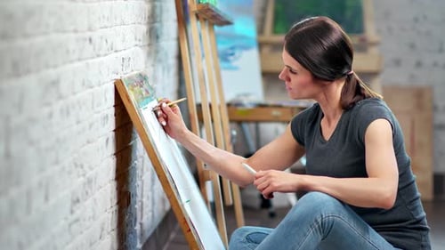 Woman Painting on Canvas in Art Studio