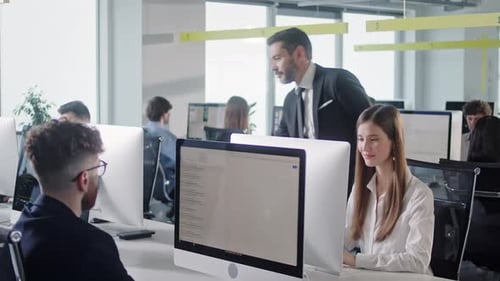 Modern Open Space Office Businessmen and Businesswomen Working in Room with Large Window and View to