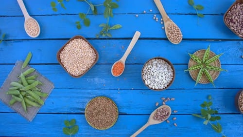 Beans and Lentils Overhead on Bright Blue Table
