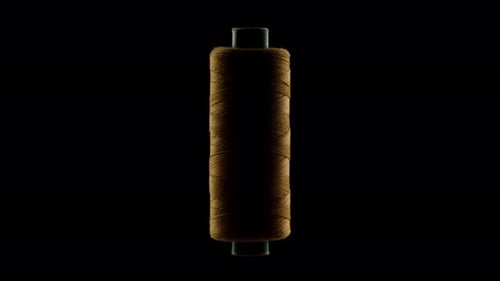 Orange Sewing Thread on a Black Background
