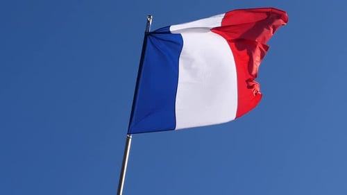 French Flag Waving Against Blue Sky