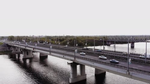 Drone Footage of Traffic Cars on a Double Road Bridge and a Railway Bridge on the Outskirts of the