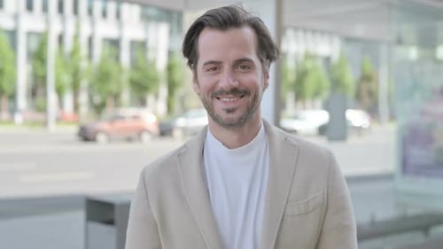 Smiling Adult Man in Business Jacket Outdoors