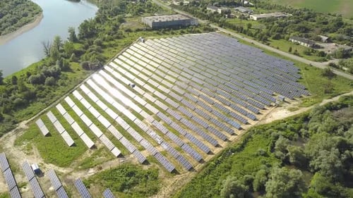 Aerial view of solar power plant field. Electrical photovoltaic panels for producing clean ecologic