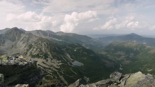 Panning shot showing panoramic view of the valley and Rohacske plesa lakes in West Tatras, Slovakia