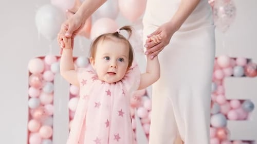 Happy Infant Celebrates First Birthday with Mother