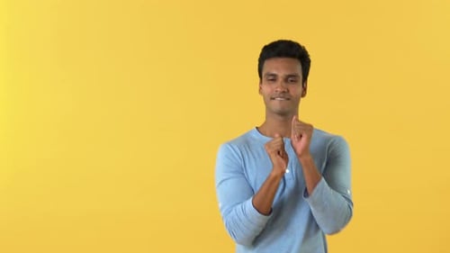 Man Dancing in Front of a Yellow Background