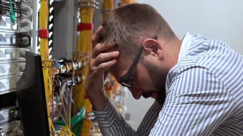 Bearded Man Working in a Data Center