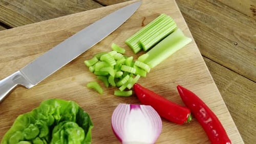 Fresh Vegetables on Cutting Board with Knife