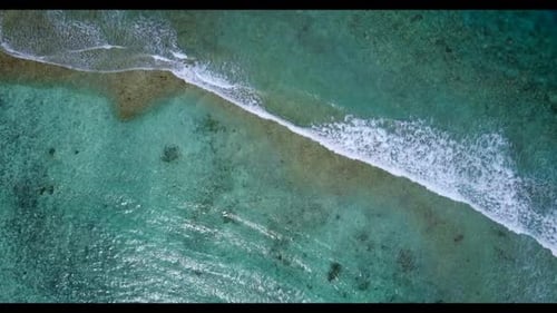 Aerial above scenery of idyllic sea view beach adventure by transparent lagoon with white sand backg