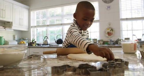 Boy Baking Cookies at Home