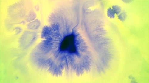 Blue Ink Spreading on Green Abstract Background