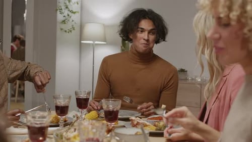 Diverse Friends Enjoying Meal Together at Home
