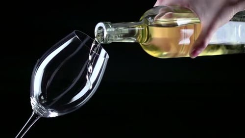 Pouring White Wine into a Glass