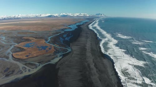 Aerial View of Patterns of Icelandic Rivers Flowing Into the Ocean. Iceland in Early Spring