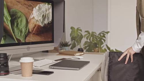Female Photographer Preparing Workplace