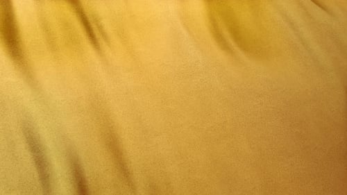 Smooth Flowing Golden Fabric Loop Background