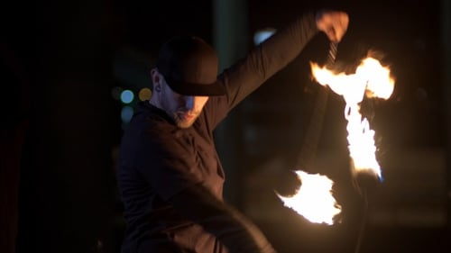 Men of the fire show artist show a performance at night under the bridge