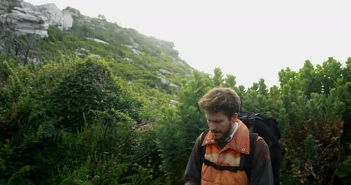 Male hiker taking photo with mobile phone 4k