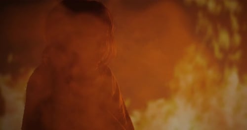 Figure Silhouetted by Fire, Dark Night Setting