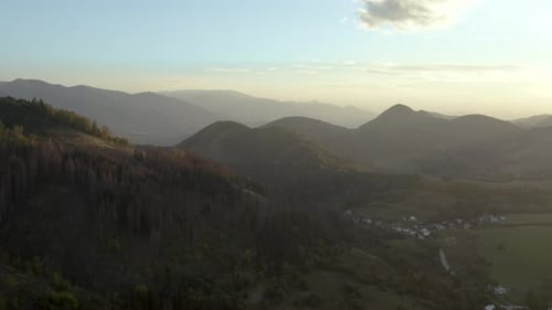 Majestic Mountains and Village at Golden Hour