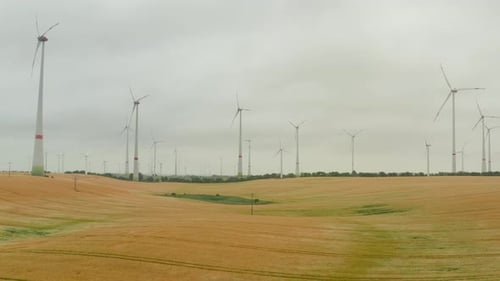 AERIAL: Wind Turbine Rotating By the Force of the Wind and Generating Renewable Energy in a Green