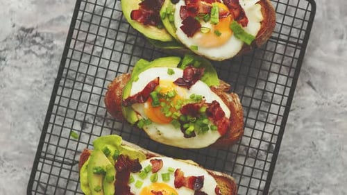 Delicious Avocado Toast with Eggs and Bacon Overhead