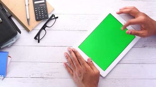 Man Hand Using Digital Tablet Top Down on Office Desk